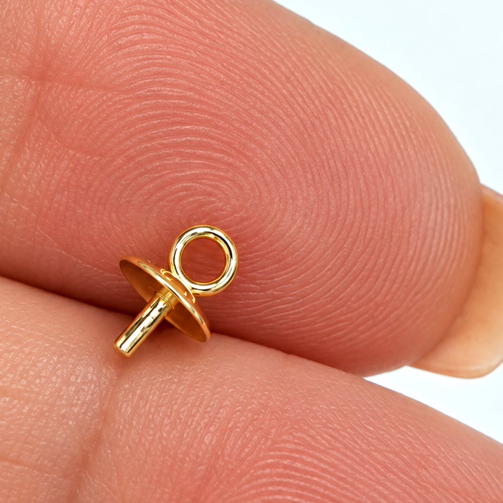 Close-up of a gold plated sterling silver pearl cup with plain shallow cup, peg and loop