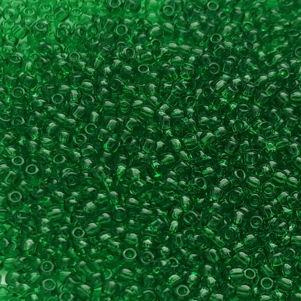 11/0 Toho Seed beads in grass green transparent TR-7b close up.