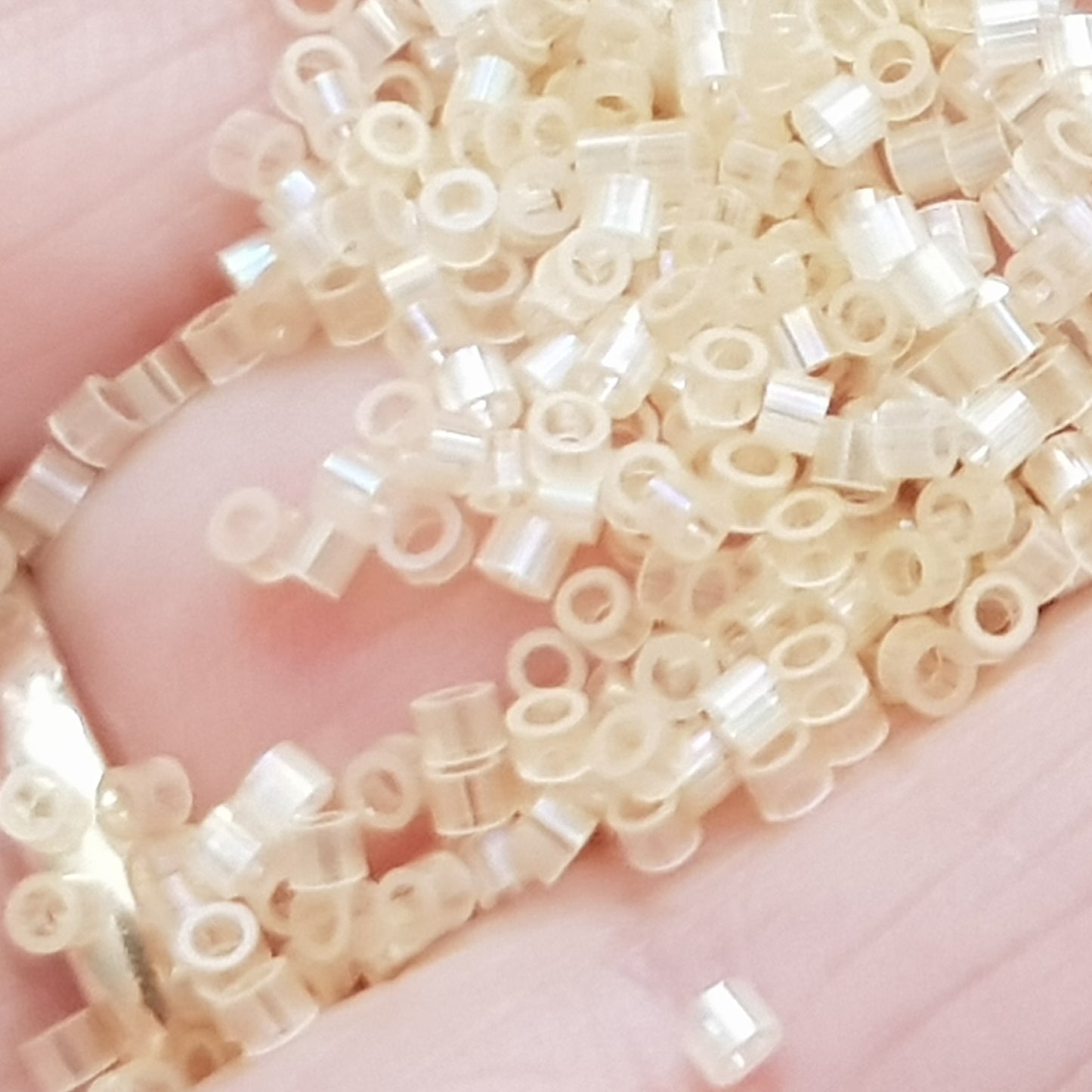 Aiko 11/0 TA-1550 Amaretto Crème Rainbow Fibre-Optic Iridescent Precision-Cut Cylinder Toho Seed Beads | Beading Supply