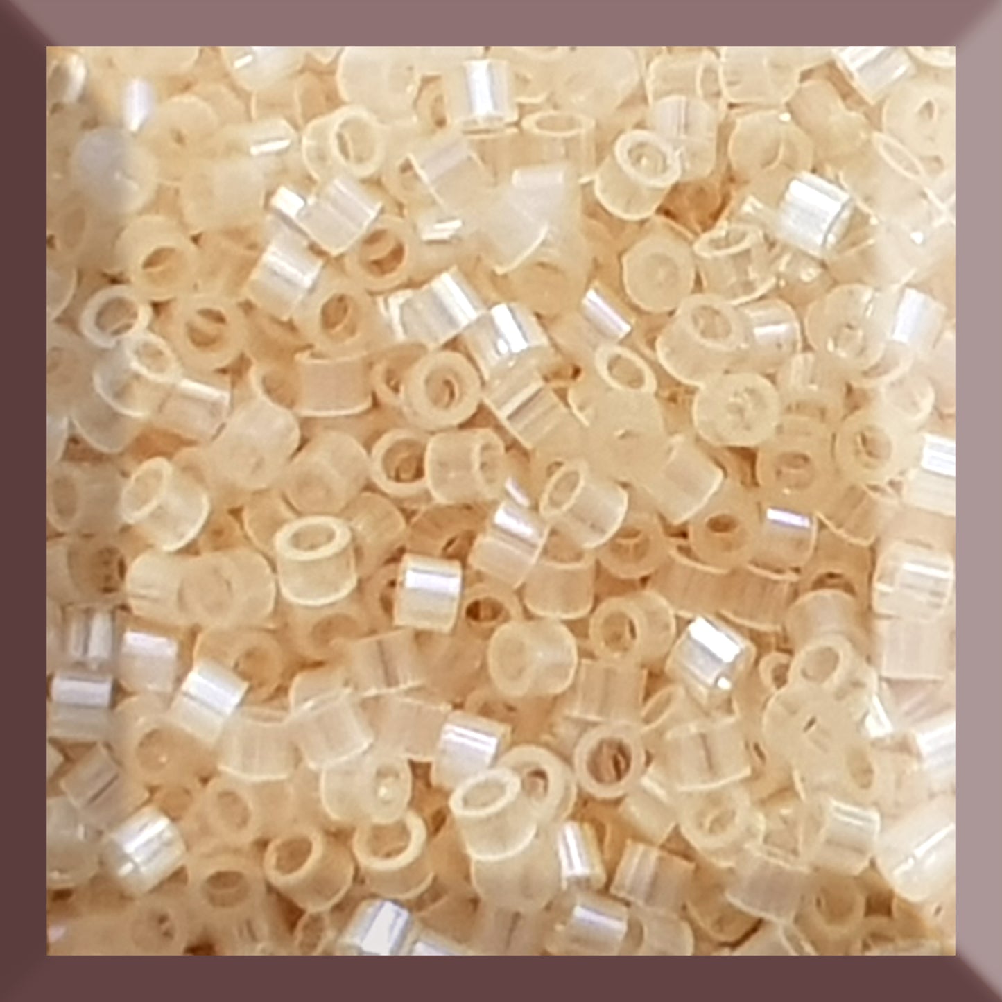 Aiko 11/0 TA-1550 Amaretto Crème Rainbow Fibre-Optic Iridescent Precision-Cut Cylinder Toho Seed Beads | Beading Supply