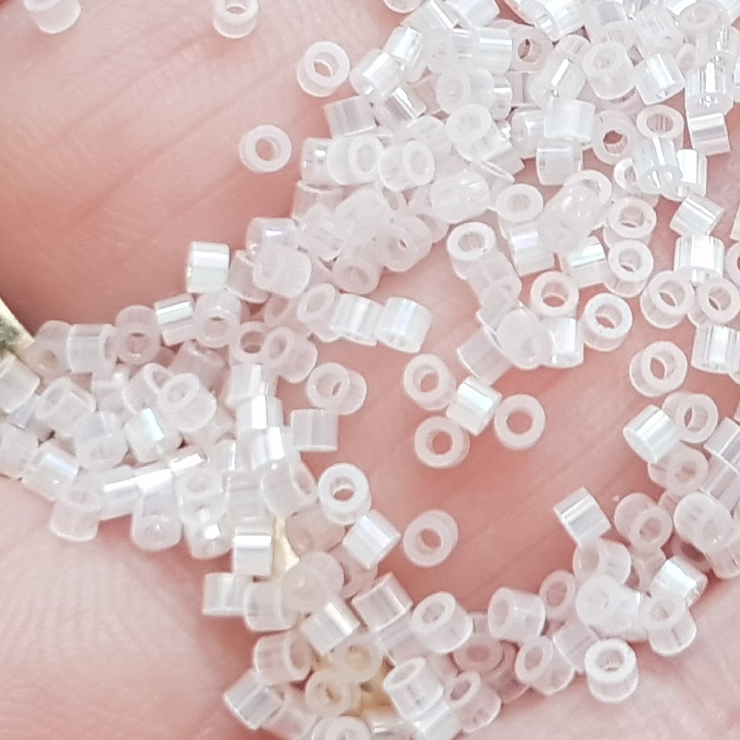Aiko 11/0 TA-1553 Powder Pink Rainbow Fibre-Optic Iridescent Precision-Cut Cylinder Toho Seed Beads | Beading Supply