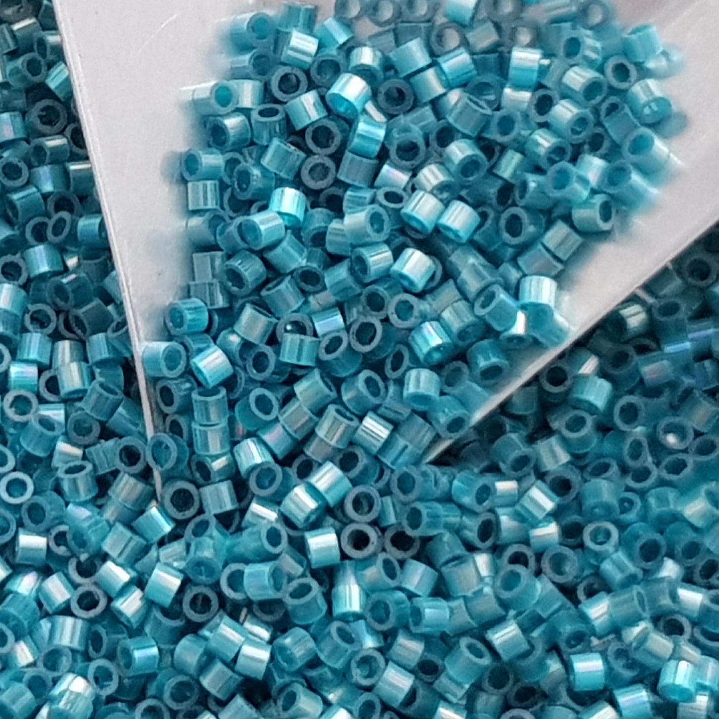 Aiko 11/0 TA-1573 Marine Blue Rainbow Fibre-Optic Iridescent Precision-Cut Cylinder Toho Seed Beads | Beading Supply