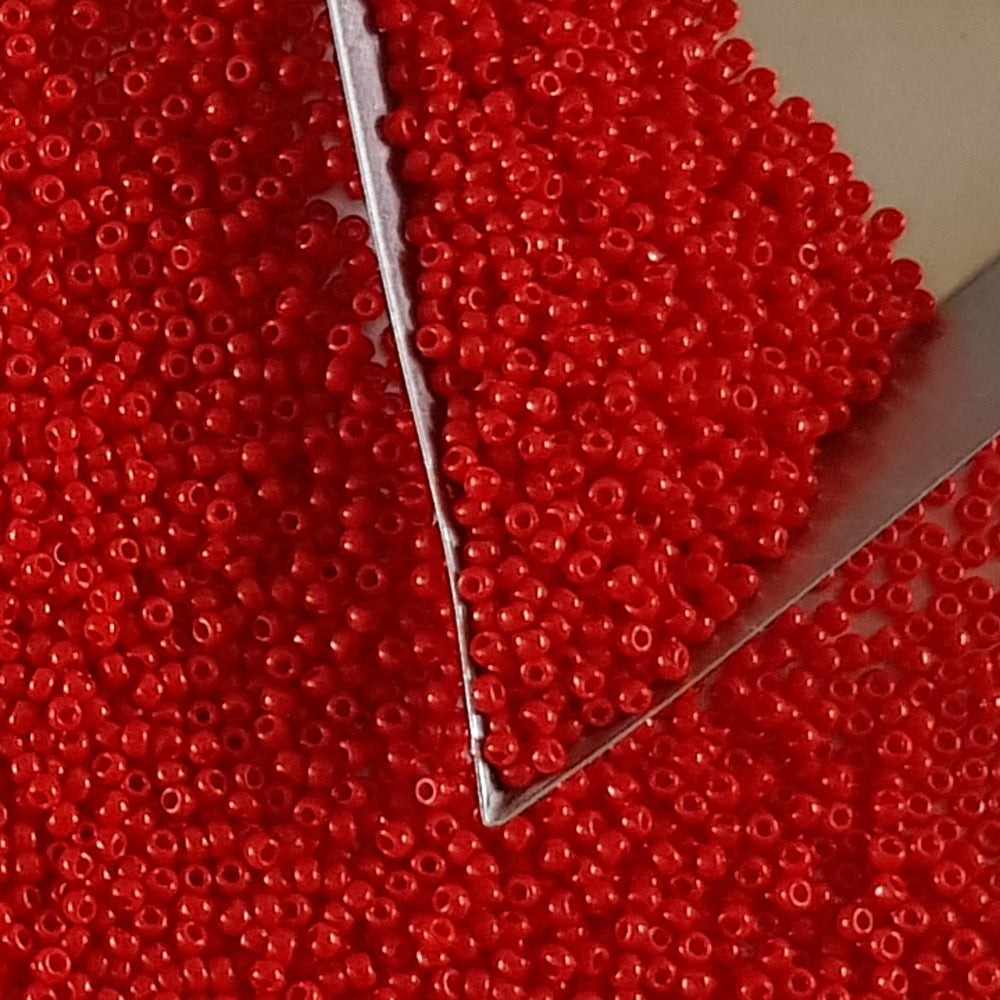 11/0 Toho seed beads 11/0 in cherry red opaque TR-45A with a triangle scoop,