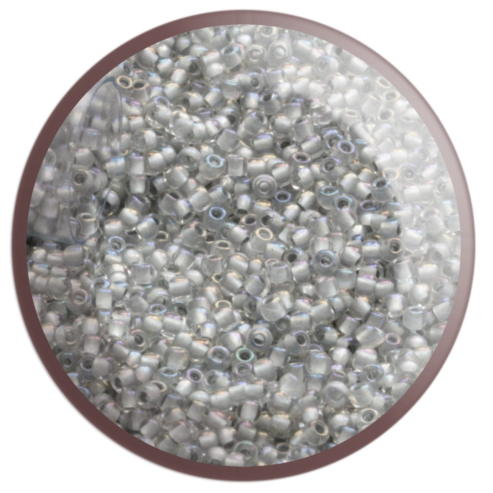 11/0 TR-261 Crystal Rainbow Grey Lined Round Toho Seed Beads circle with white background.
