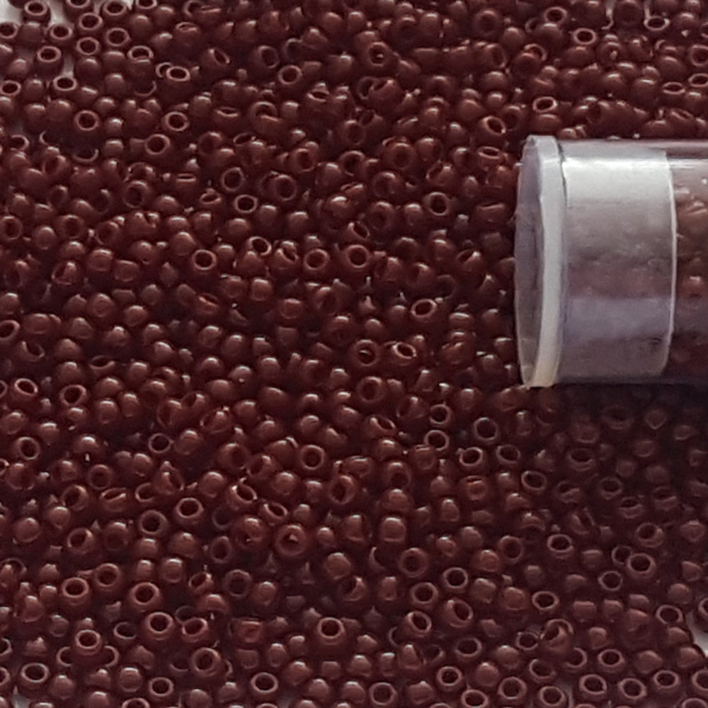 11/0 TR-46 Oxblood Opaque Round Toho Seed Beads close up.