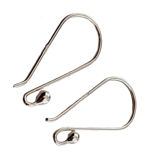 Silver earring hooks on a white background