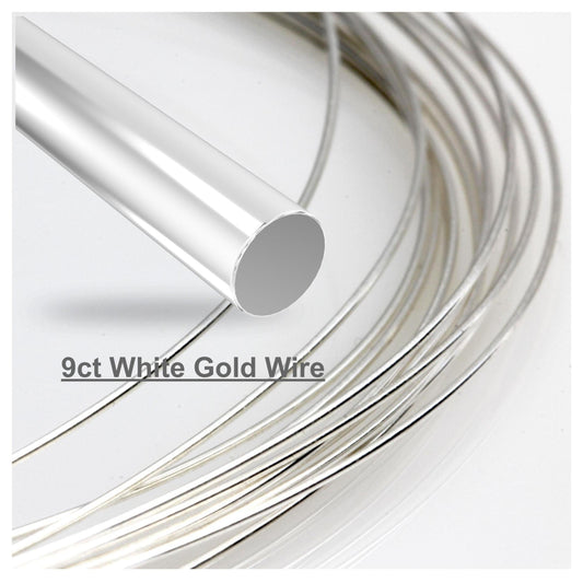 A coiled piece of round 9ct white gold wire, with the label indicating the metal type.