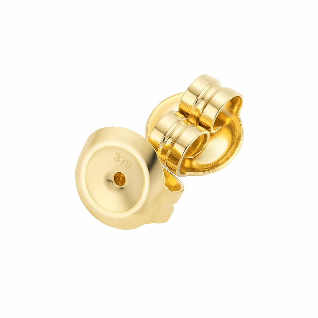 Gold earring on a white background
