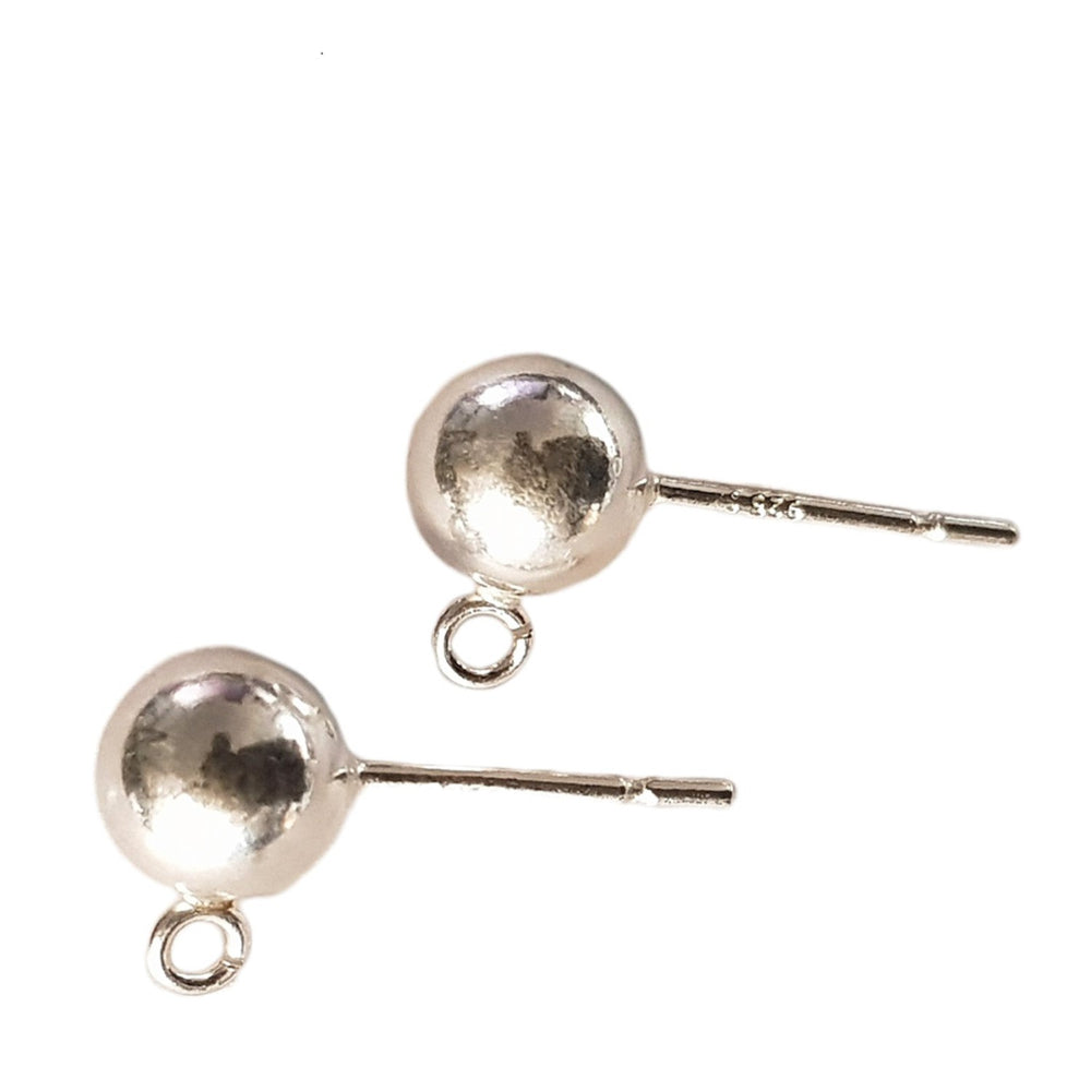 Pair of silver round earrings on a white background