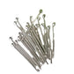 Metal pins with balled ends on a white background