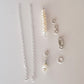 DIY Silver chain with pearl parts included on a light gray background