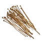 Gold headpins on a white background