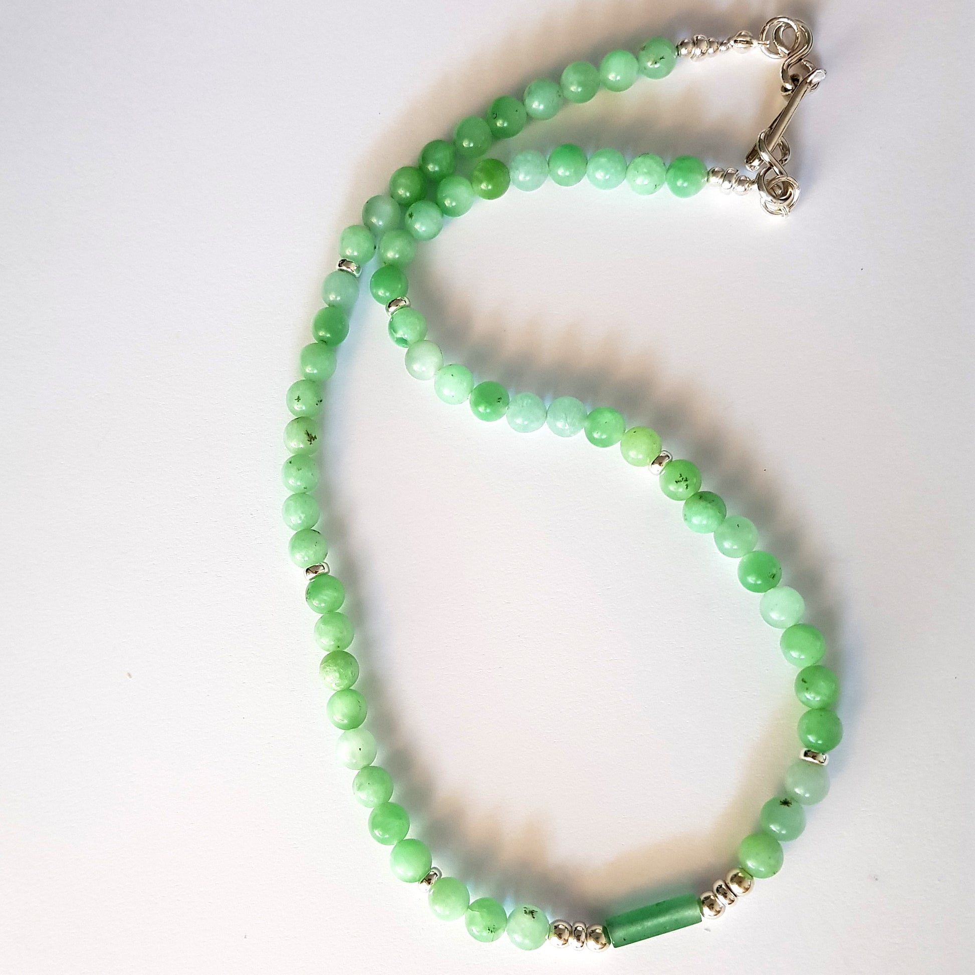Green Jade beaded necklace on a white background