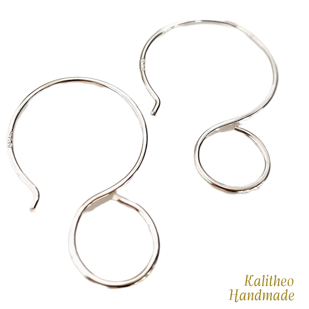 Silver hoop earrings on a white background with 'Kalitheo Handmade' text.