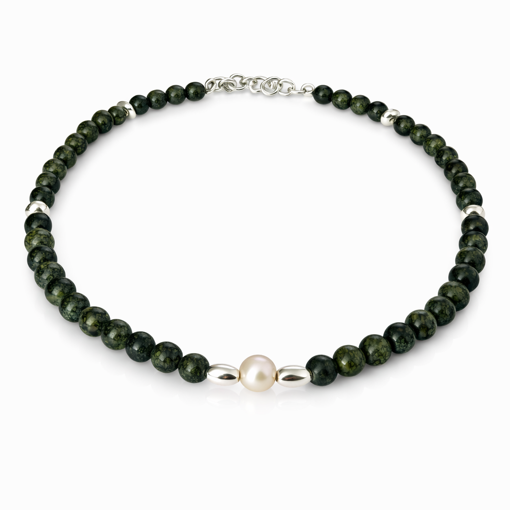 Necklace with green beads and a pearl on a white background