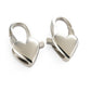 Pair of silver heart-shaped clip-on earrings on a white background