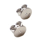 Pair of sterling silver 925 disc earring backs white background.