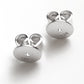 Pair of sterling silver disc butterfly earring backs with a white background.