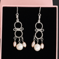 Pair of handmade chandelier pearl earrings presented in a pink gift box, sterling silver with white and soft-pink freshwater pearls – FKJ-210E by Kalitheo