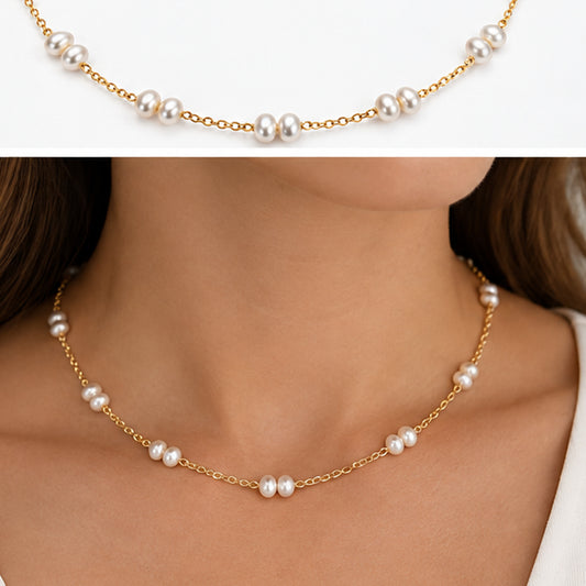 Woman wearing handmade gold filled freshwater pearl station necklace 45cm, styled against a white top, showing necklace drape and pearl placement at the collarbone
