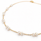 Close-up of freshwater pearls wire-wrapped on gold filled cable chain, showing natural pearl lustre and gold link detail
