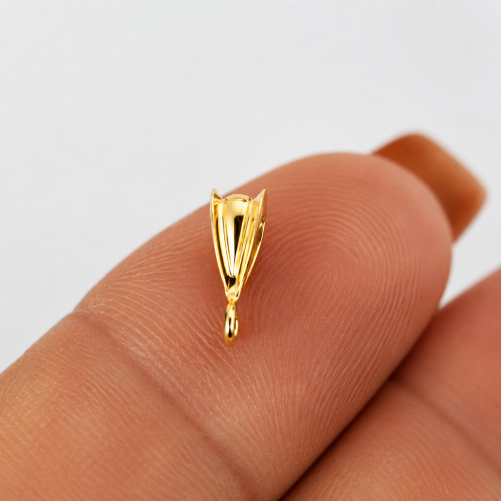 Gold Filled Pendant Bail with Jump Ring on a finger with white background