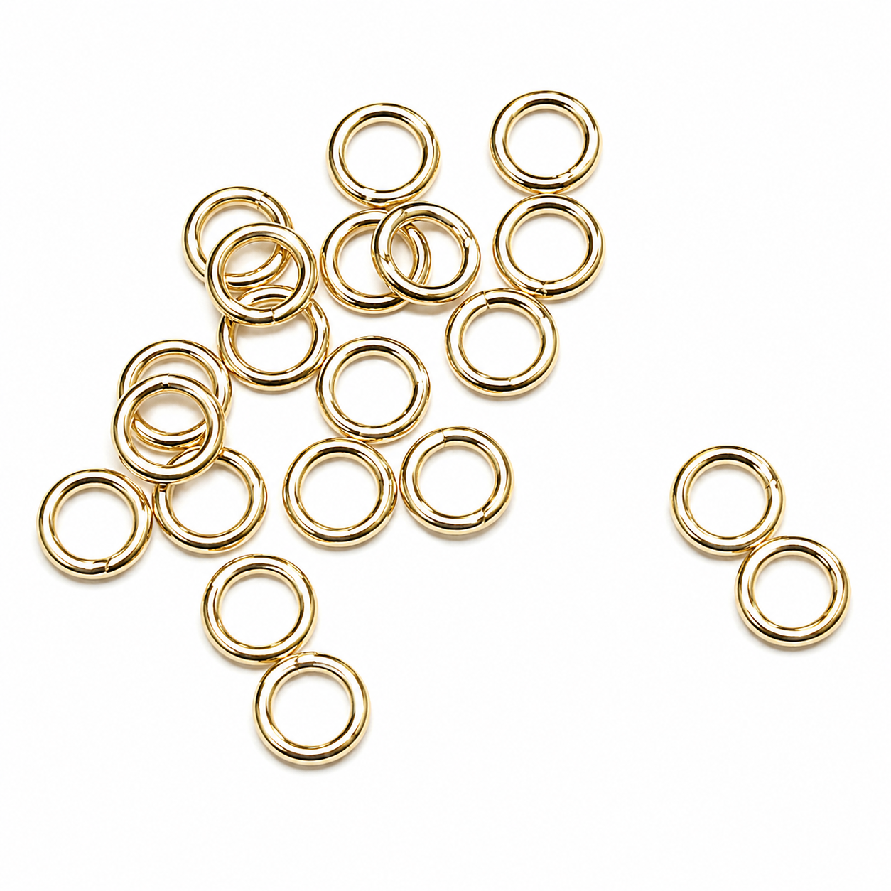 Sterling Silver Gold Plated Closed Jump Rings 5mm x 0.8mm for jewellery making and jewellery repairs. on a white background