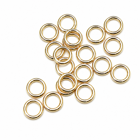 Sterling Silver Gold Plated Closed Jump Rings 5mm x 0.8mm for jewellery making and jewellery repairs. White background