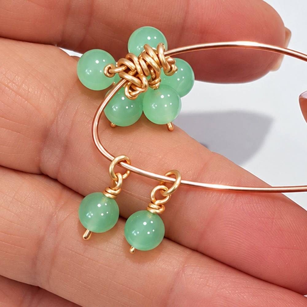 Cluster of 6.5 mm green jade bead dangles with open jump rings arranged on a gold-coloured hoop