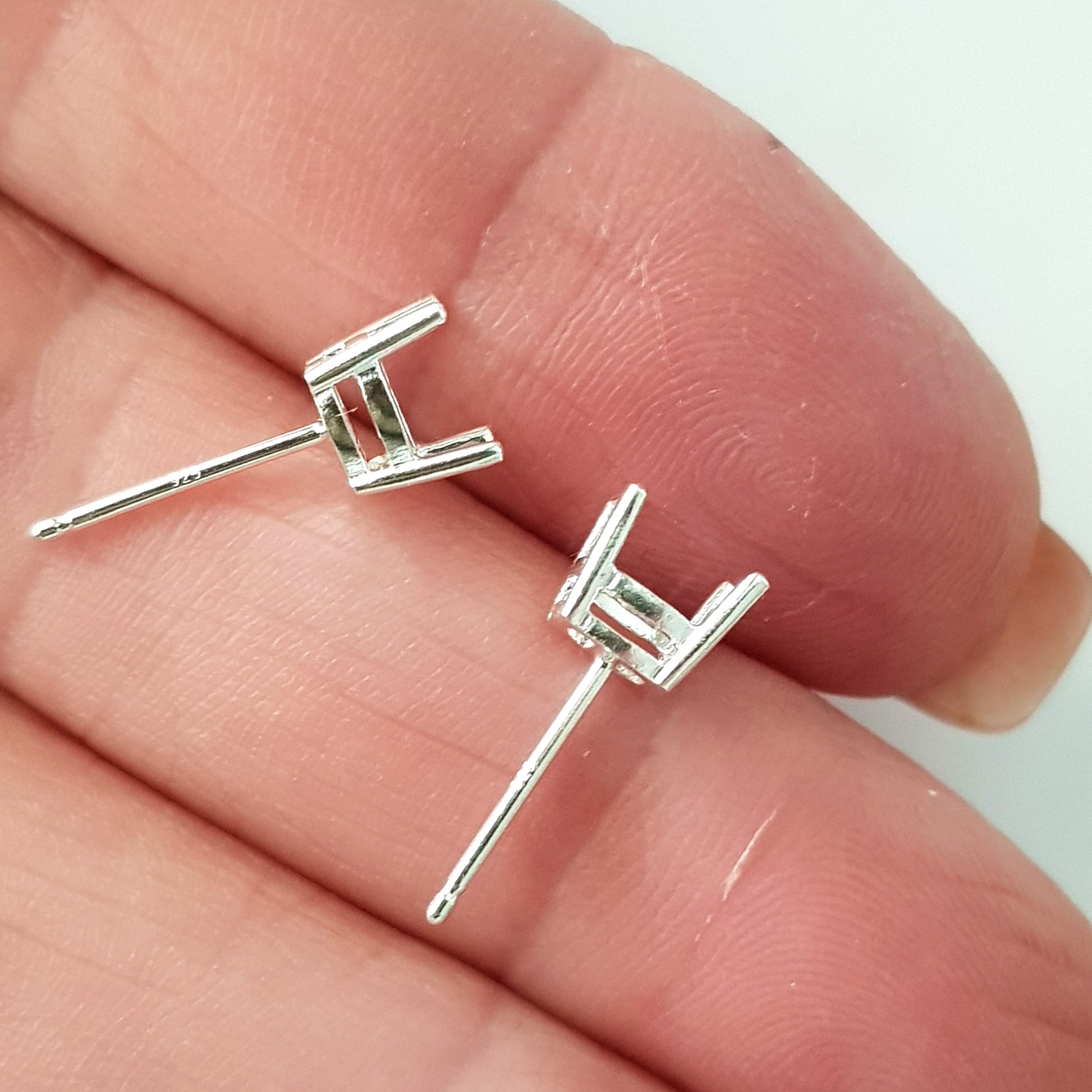 Oval Basket 4 Claw Setting earring posts - on hand close up