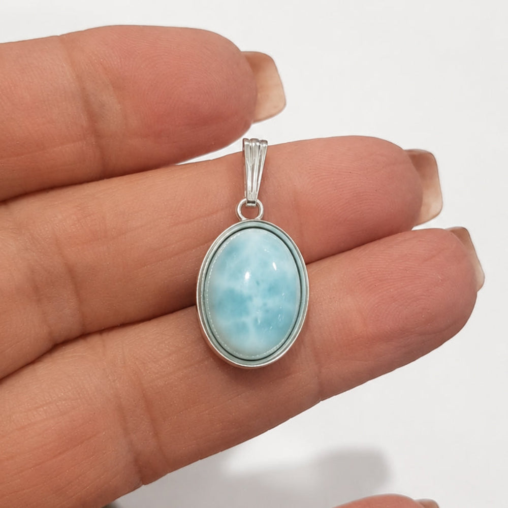 Oval Pendant Setting in Sterling Silver with a Gemstone white background