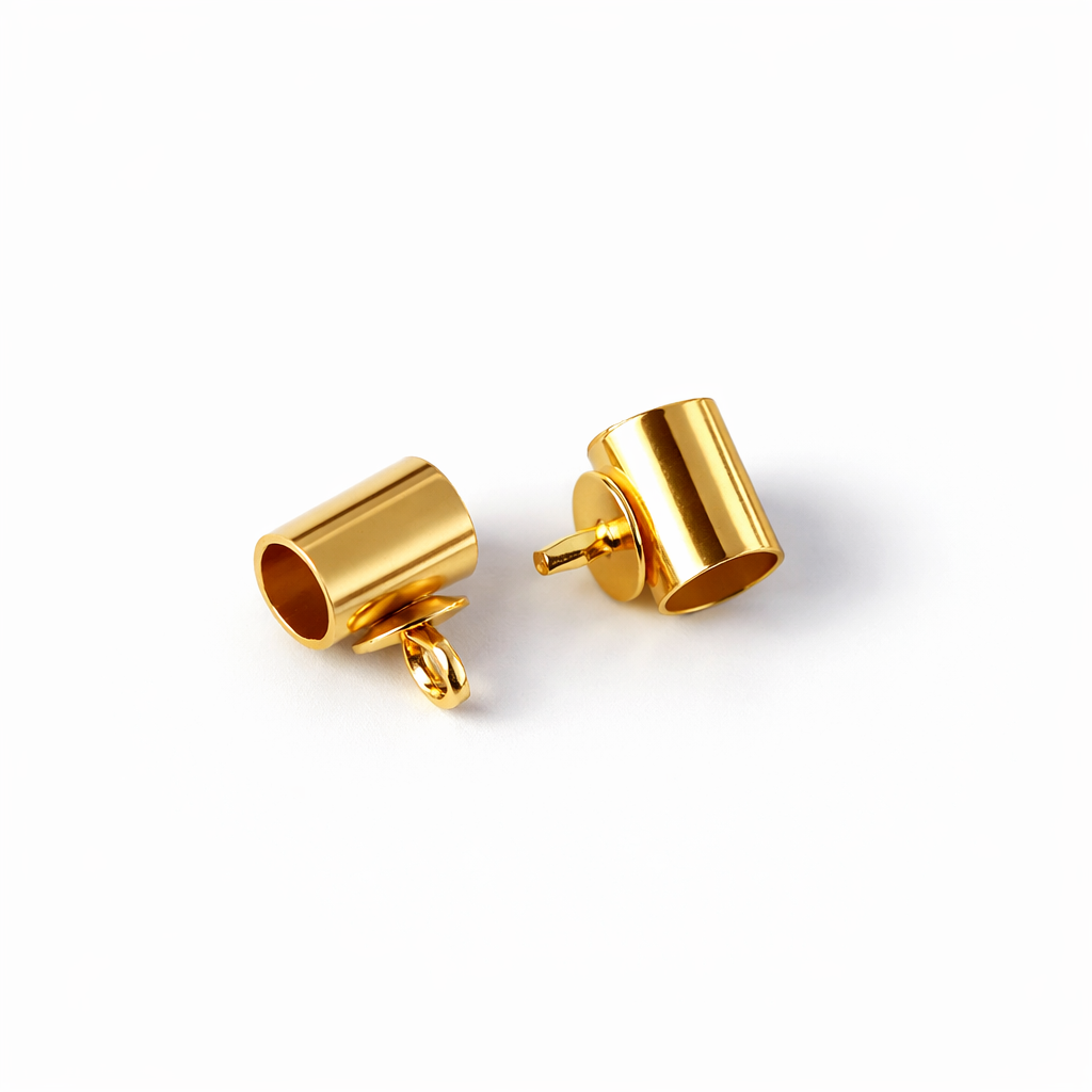 Two gold cylindrical earring components on a white background