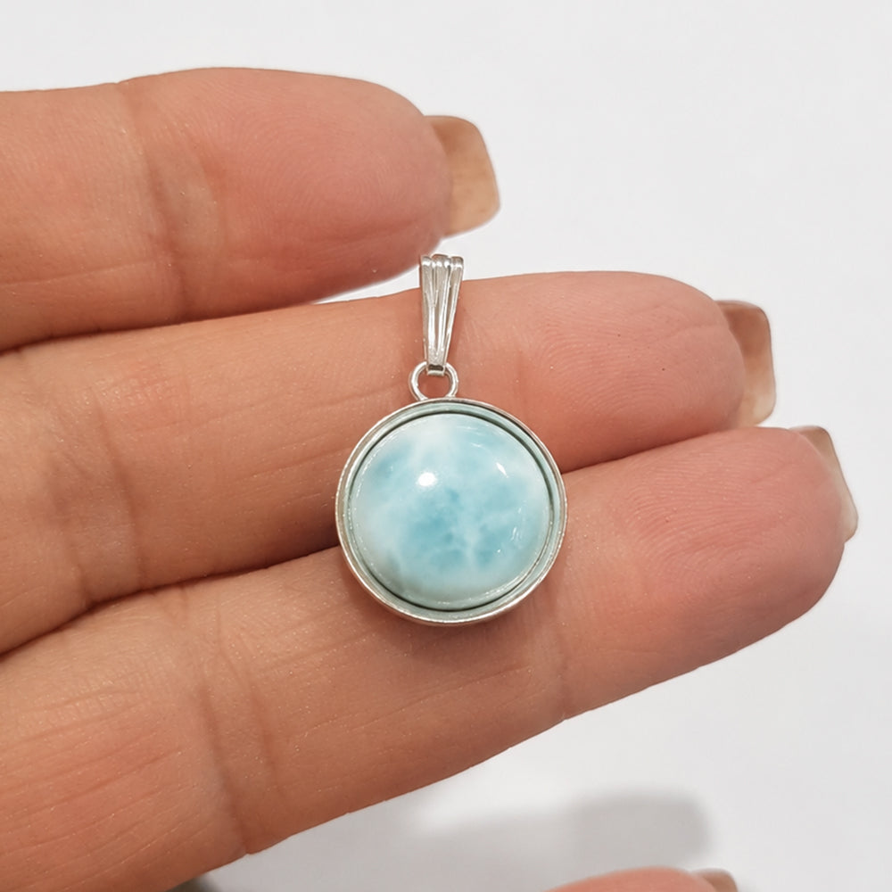 Sterling Silver Round Bezel Pendant Setting with Gemstone white background.