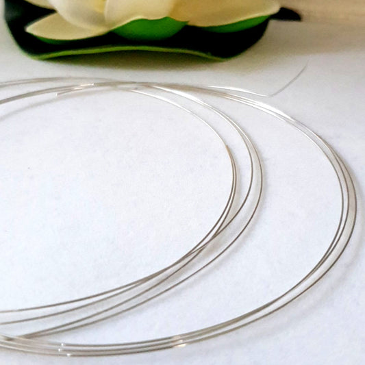 Silver Solder in 0.5mm thickness coiled on a white background.