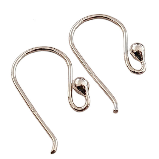 Two silver earring hooks on a white background
