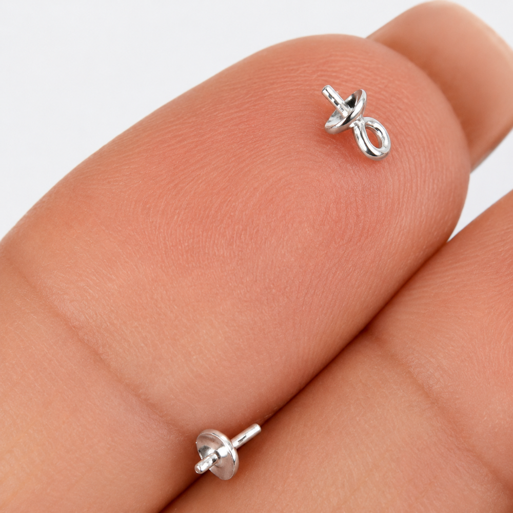 Sterling Silver 925 Pearl Cups on a hand with white background.
