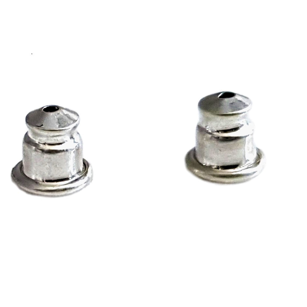 close up sterling silver bullet style earring backs on white background