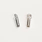Two sterling silver narrow tube end caps standing upright on a white background, showing the slim cylindrical body and loop bail from the side and top