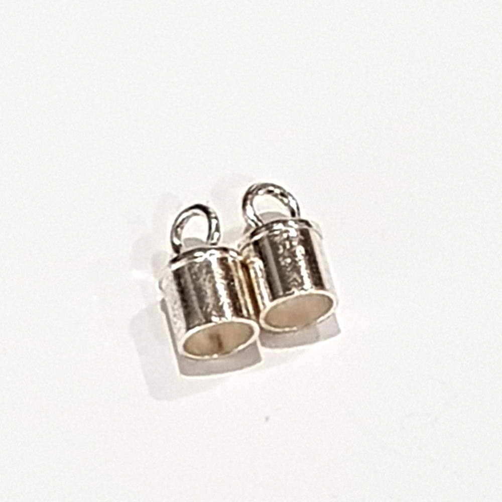 Three sterling silver tube end caps and a smaller narrow style end cap on a white background, showing the variety of barrel and slim tube styles