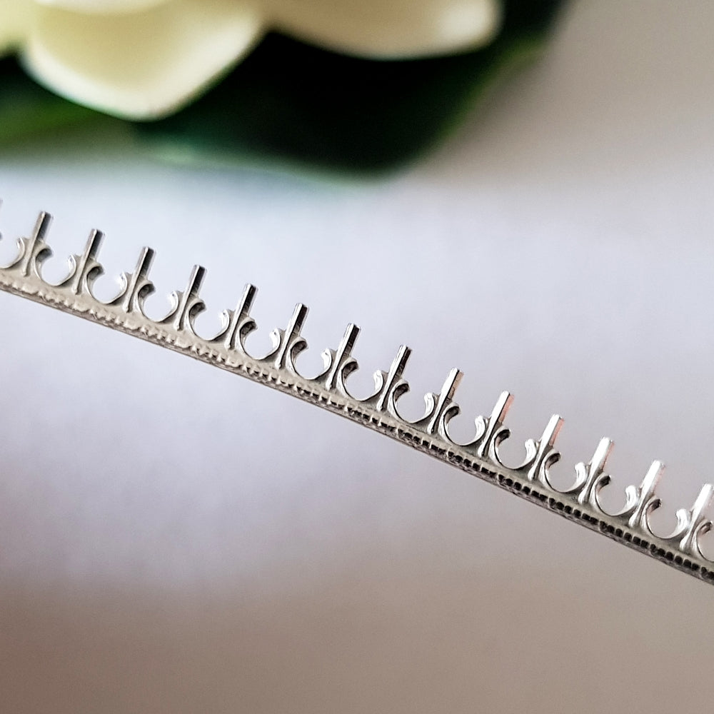 A close up on white background sterling silver gallery wire No2