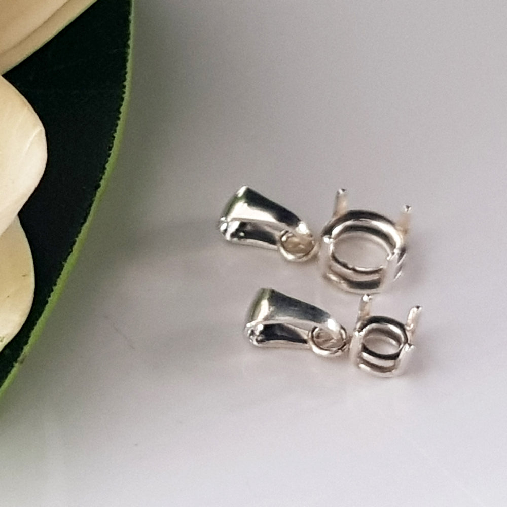 Sterling Silver 925 2 sizes on a white surface.