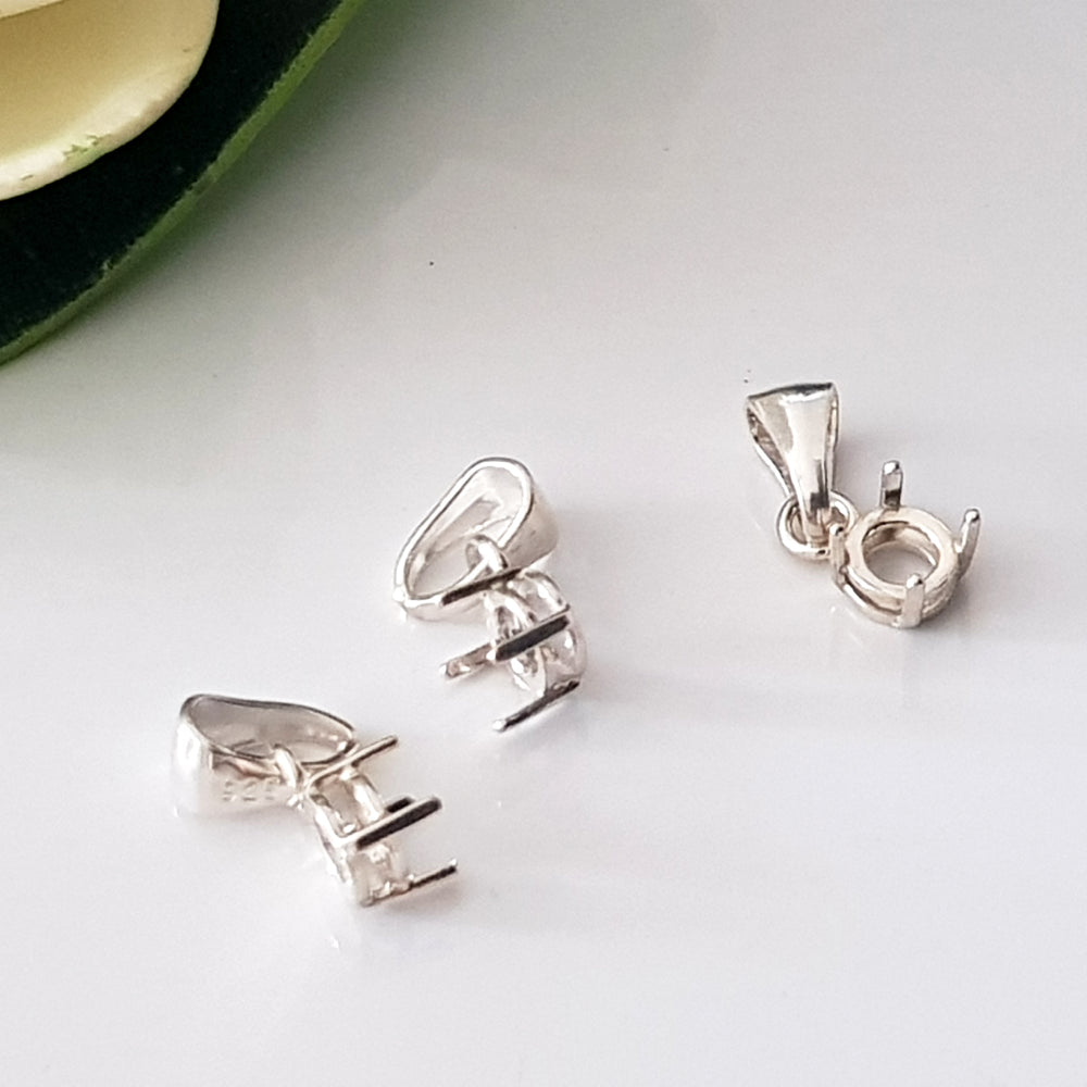sterling silver 925 basket claw setting on a white surface