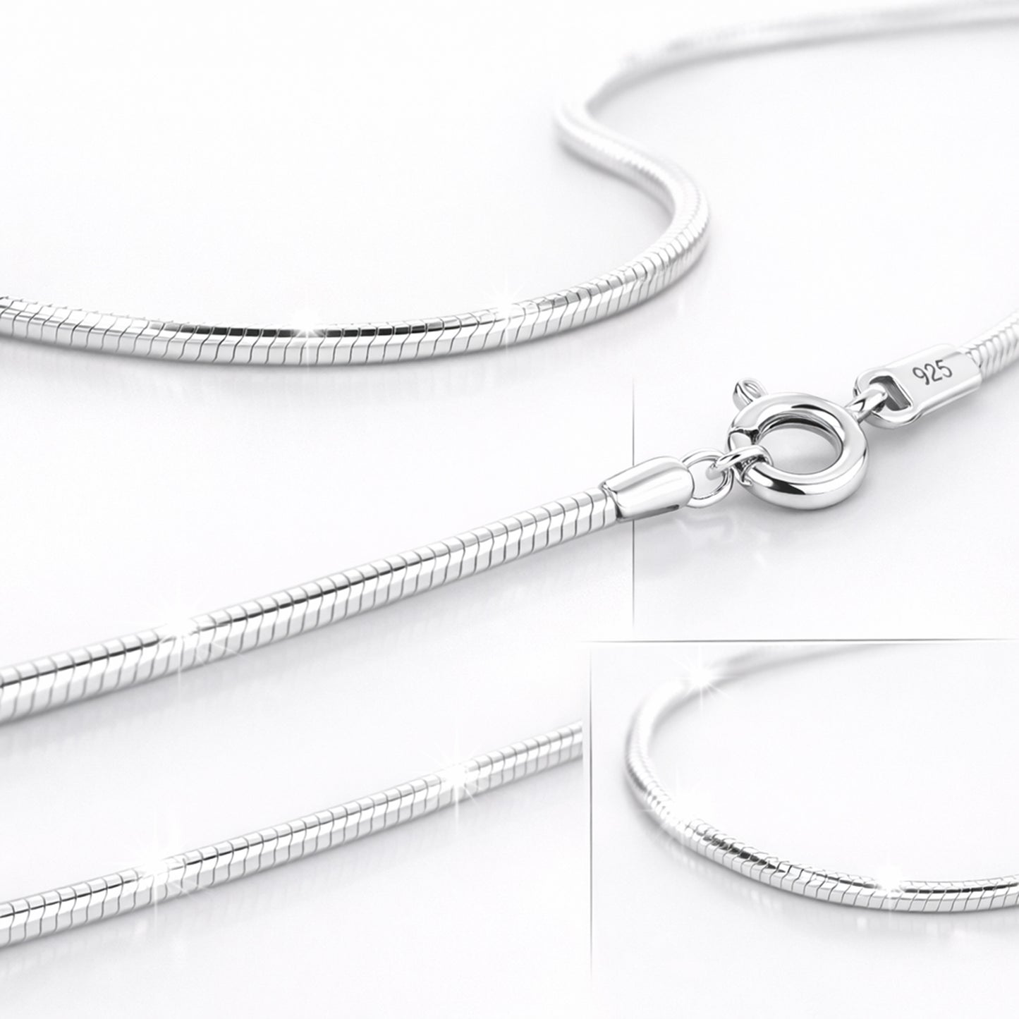 Close up Silver snake chain necklace on a white background