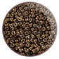 A round, antique bronze opaque Toho seed bead with a permanent finish.