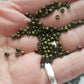 11/0 TR-617 Dark Olive Matte Round Toho Seed Beads on hand.