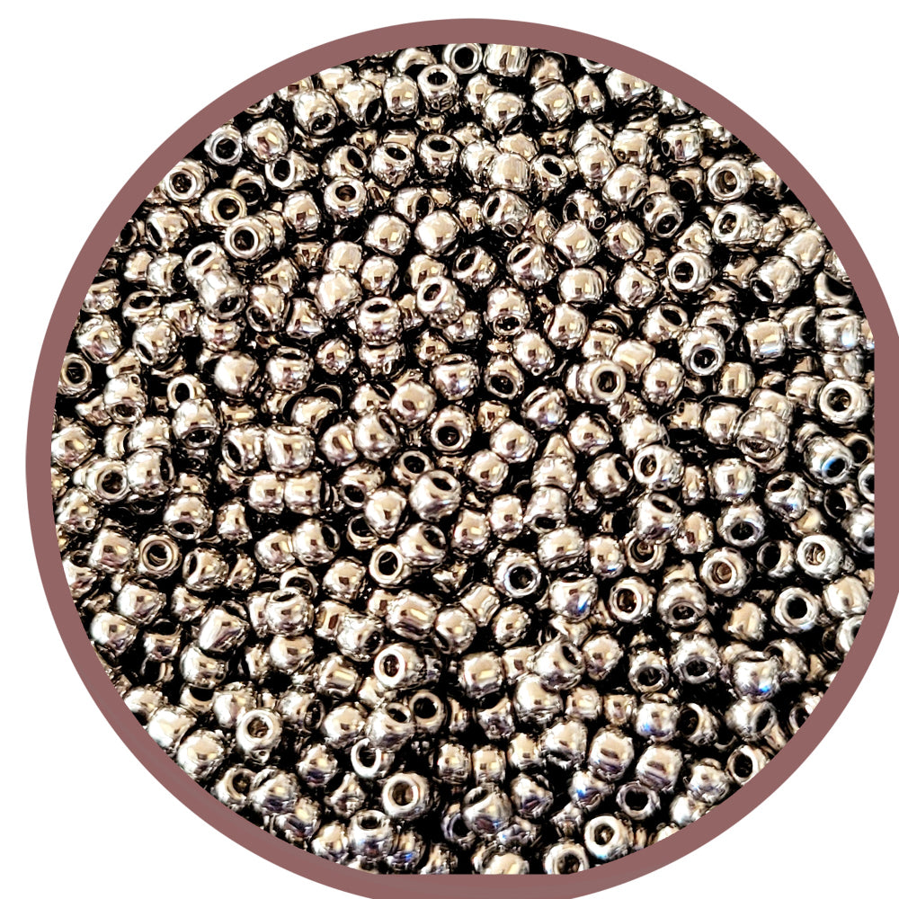 A close-up of nickel silver round Toho seed beads 11/0 TR-711