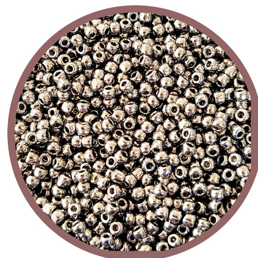 A close-up of nickel silver round Toho seed beads 11/0 TR-711