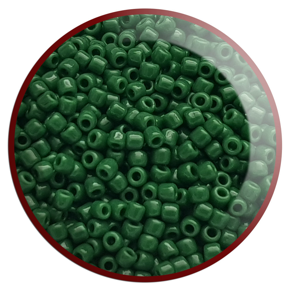 11/0 Toho seed beads in pine green opaque TR-47H in a circle white background.