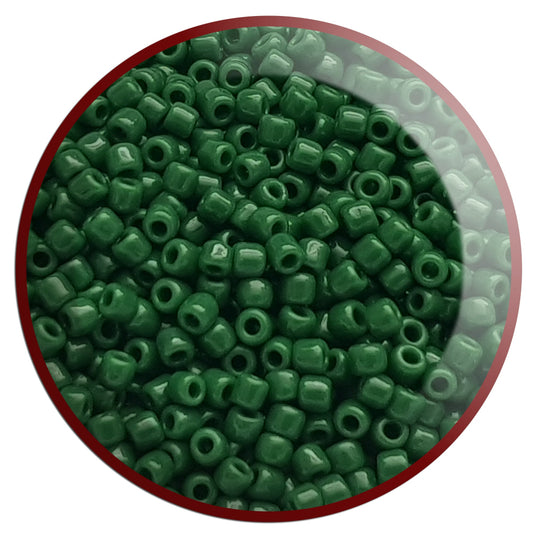 11/0 Toho seed beads in pine green opaque TR-47H in a circle white background.