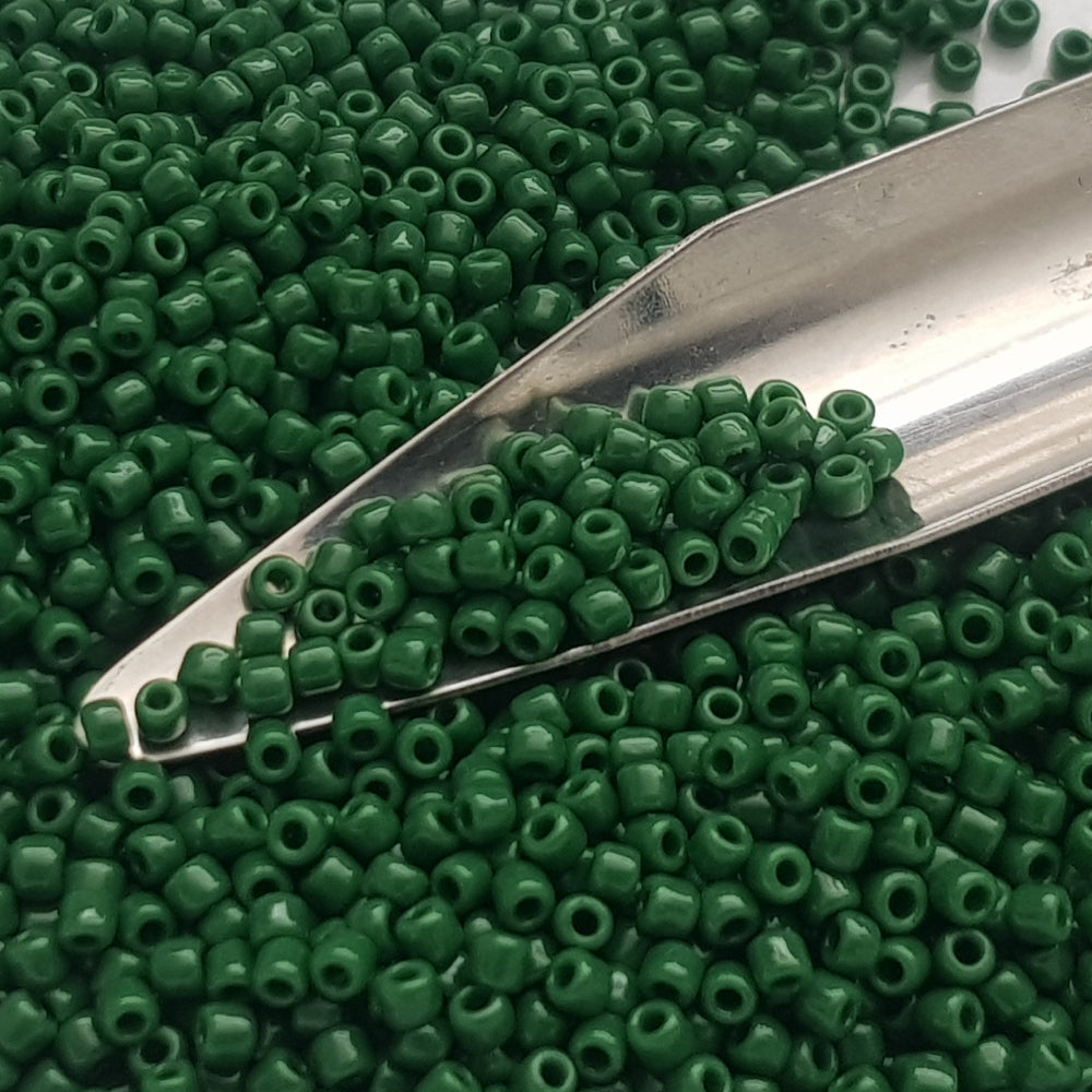 11/0 Toho Seed beads in pine green opaque with a beading scoop.